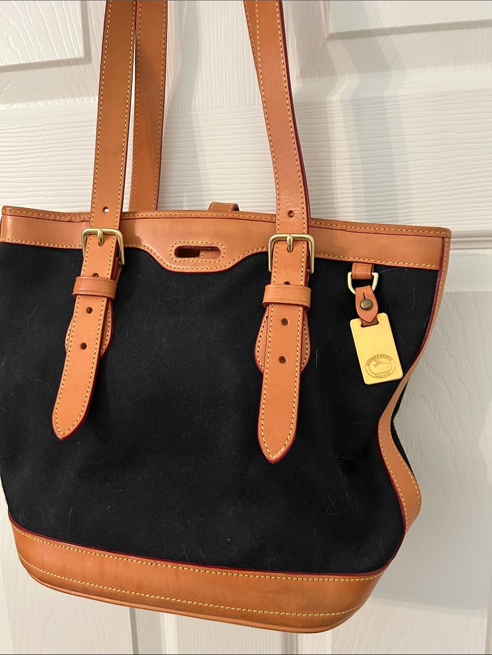 Dooney & Bourke Black Canvas Tote with Tan Leather Trim and Gold Tag